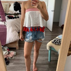 Show me your Mumu strapless top with tassels.